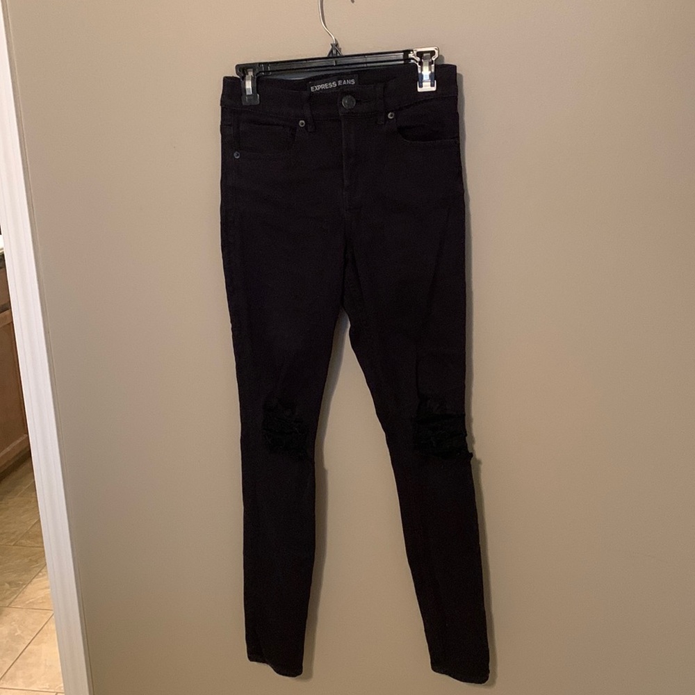Express black straight leg jeans with holes in knee. Size 4